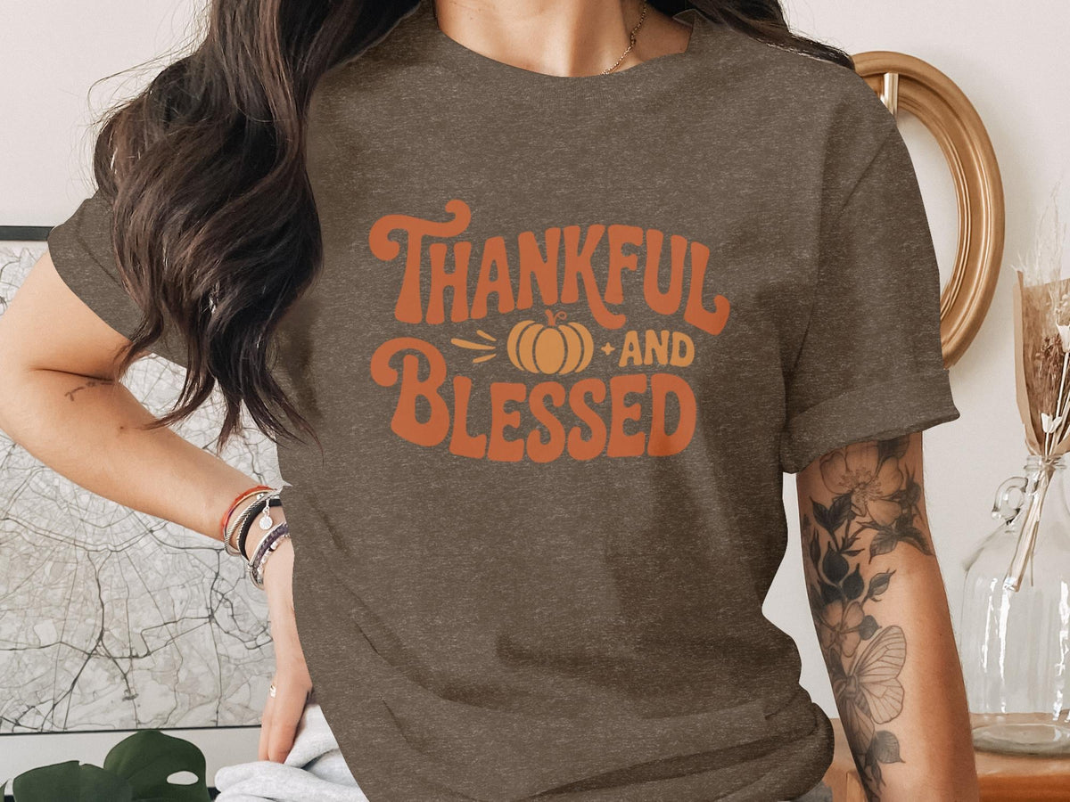 Brown t-shirt with orange "Thankful and Blessed" text and a pumpkin graphic.