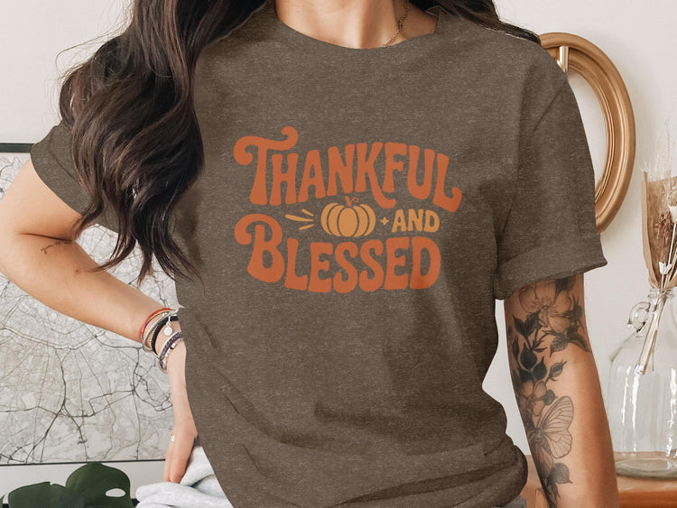Brown t-shirt with orange "Thankful and Blessed" text and a pumpkin graphic.