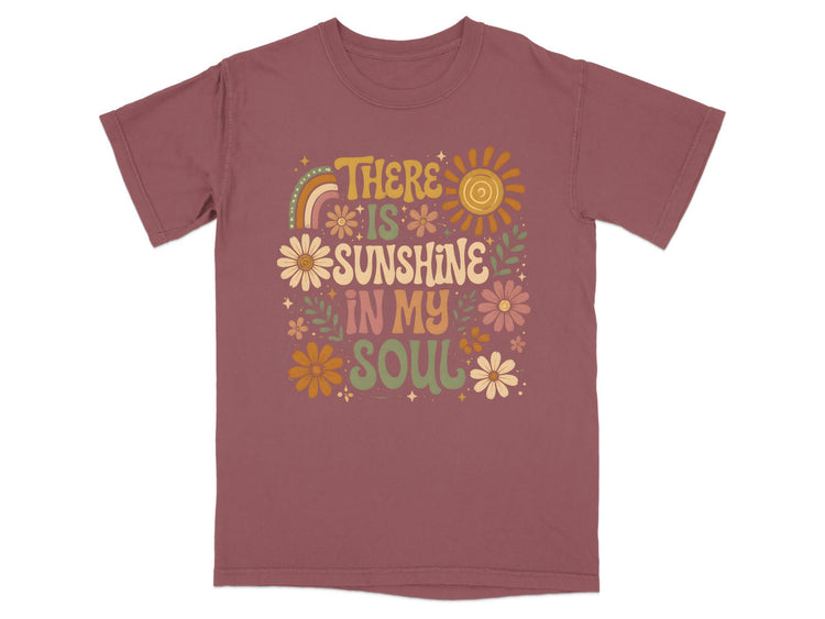 T-shirt with text "There is sunshine in my soul" and floral design.