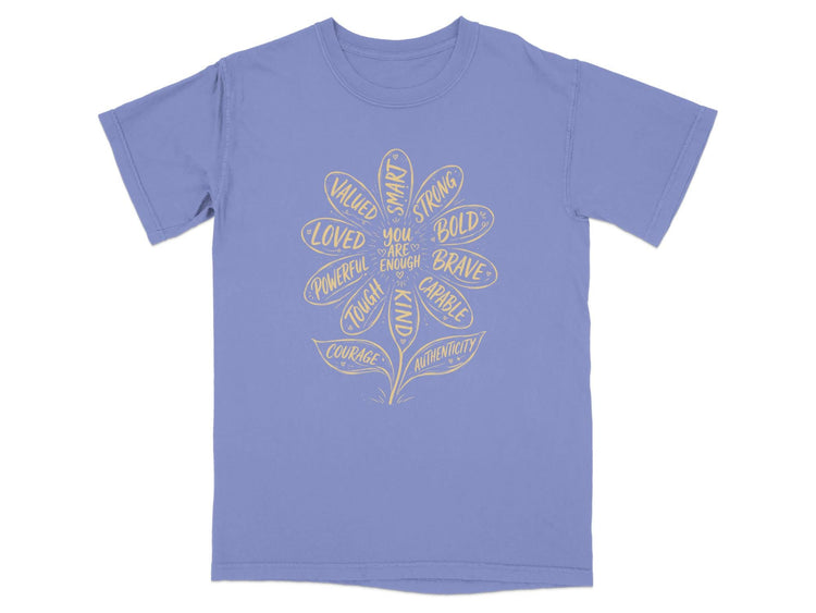 T-shirt with a floral design featuring words like "Smart," "Bold," and "Brave."