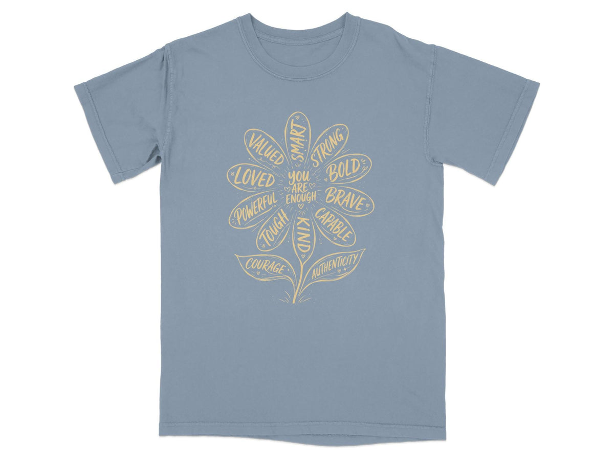Blue t-shirt with a flower graphic listing positive affirmations including "You are enough."