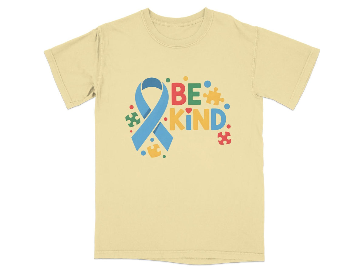 Light yellow t-shirt with blue ribbon and "BE KIND" text, surrounded by puzzle pieces.
