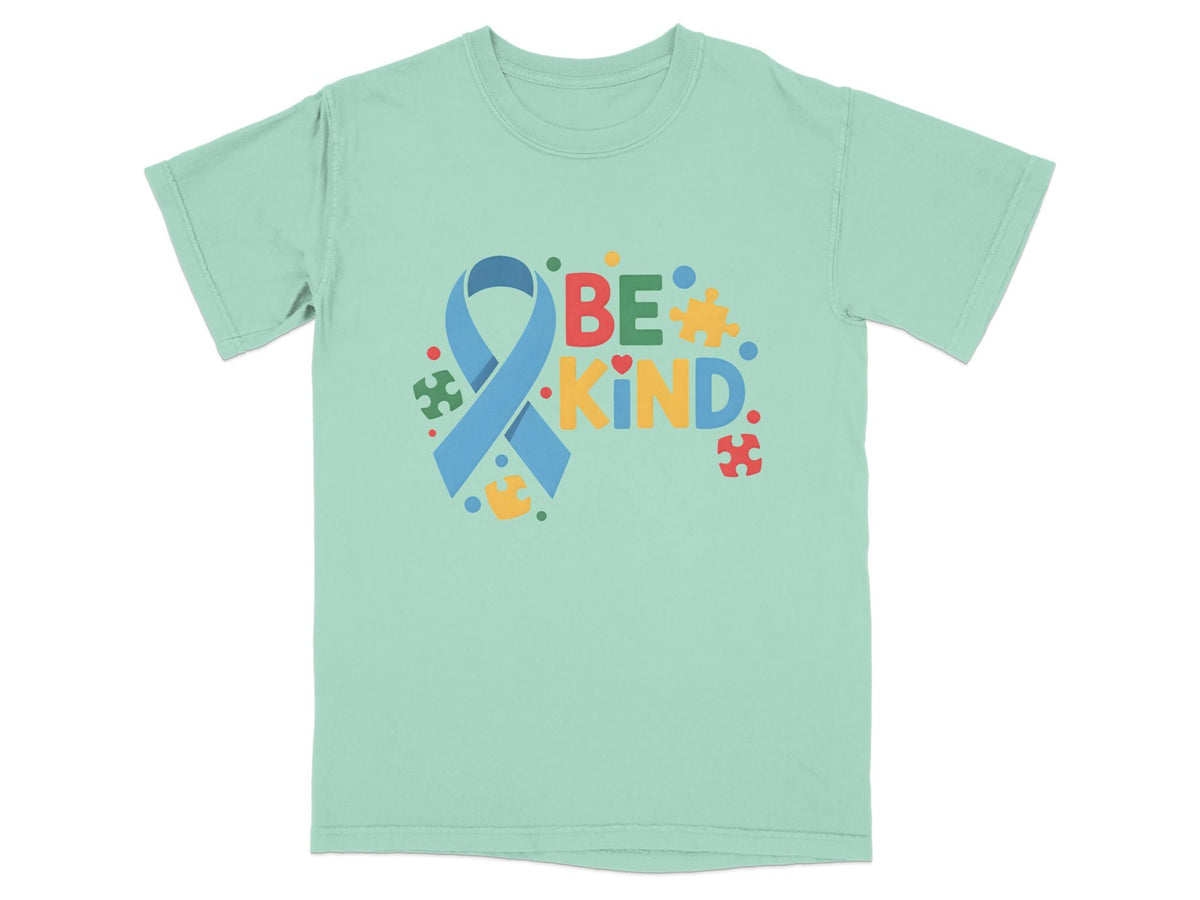 Light blue t-shirt with "BE KIND" text and autism awareness ribbons.