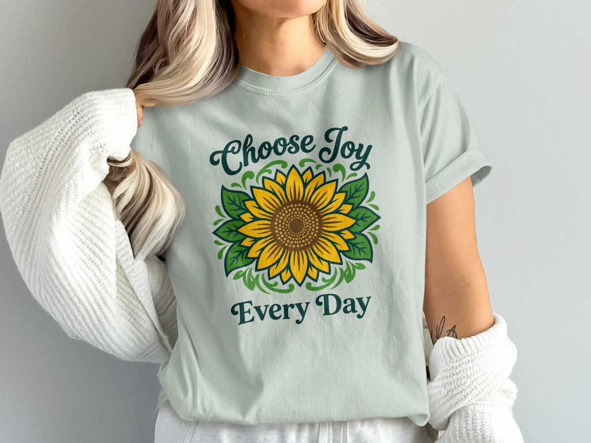 Light blue t-shirt with sunflower graphic and text "Choose Joy Every Day".