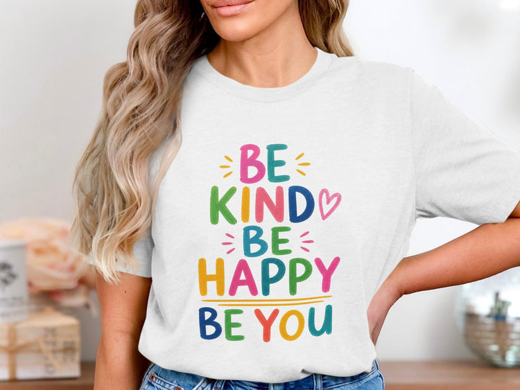 White t-shirt with colorful text: "BE KIND BE HAPPY BE YOU".