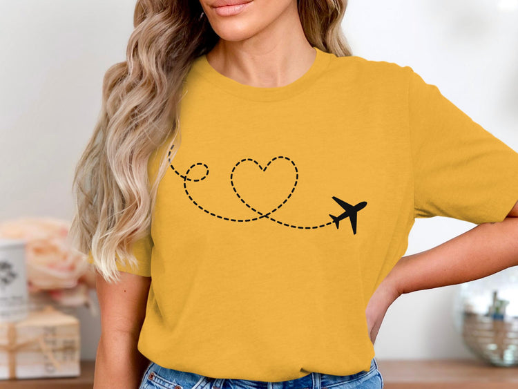 Yellow t-shirt with a black airplane and dotted heart trail graphic.