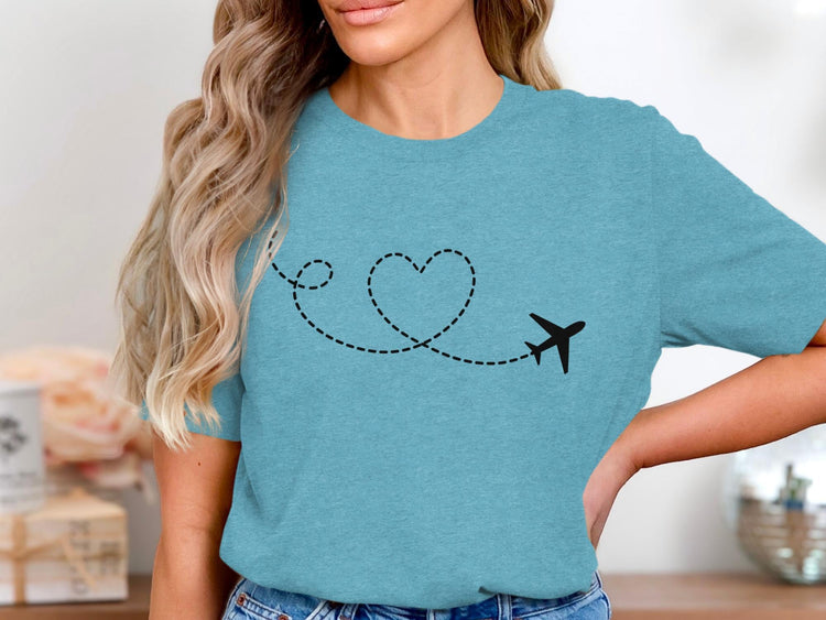 Teal t-shirt with a black airplane and dashed heart-shaped flight path design.