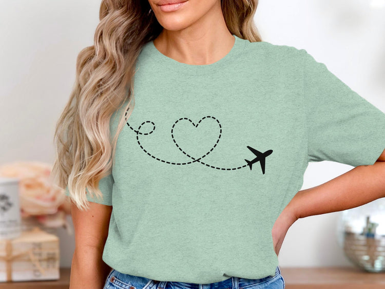 Mint green t-shirt with black airplane and heart-shaped dotted line graphic.