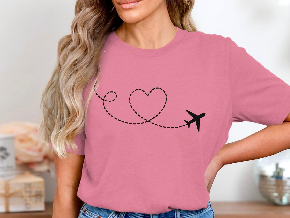 Pink t-shirt with a black airplane and dotted heart line design.