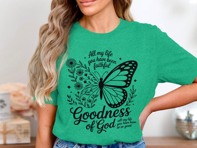 Green t-shirt with a black butterfly design and text "Goodness of God".