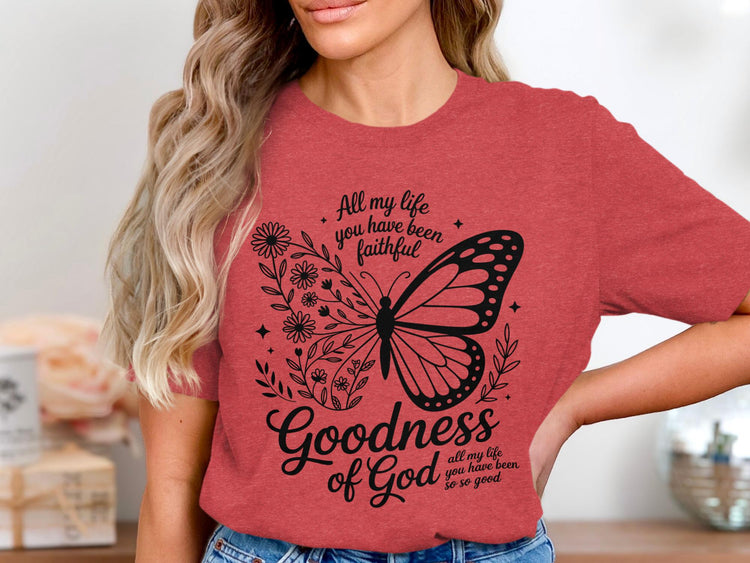 Red t-shirt with a butterfly and floral graphic reading "Goodness of God".