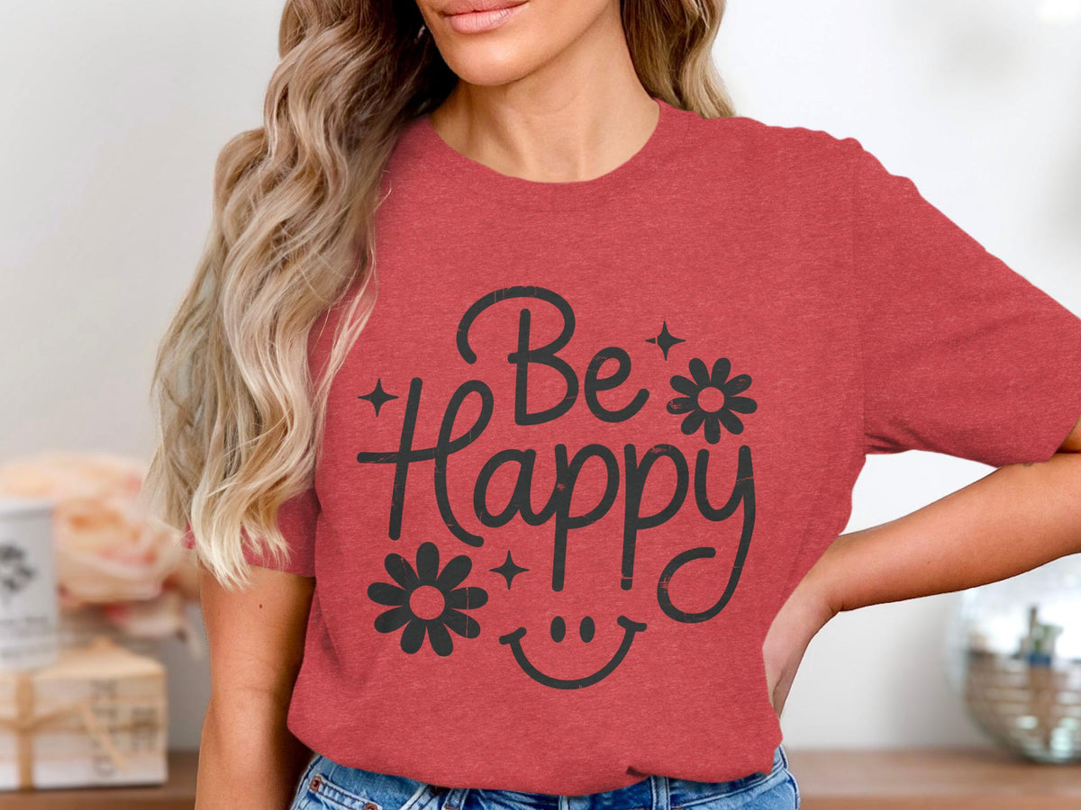 Red graphic t-shirt with "Be Happy" text, smiley face, and flowers