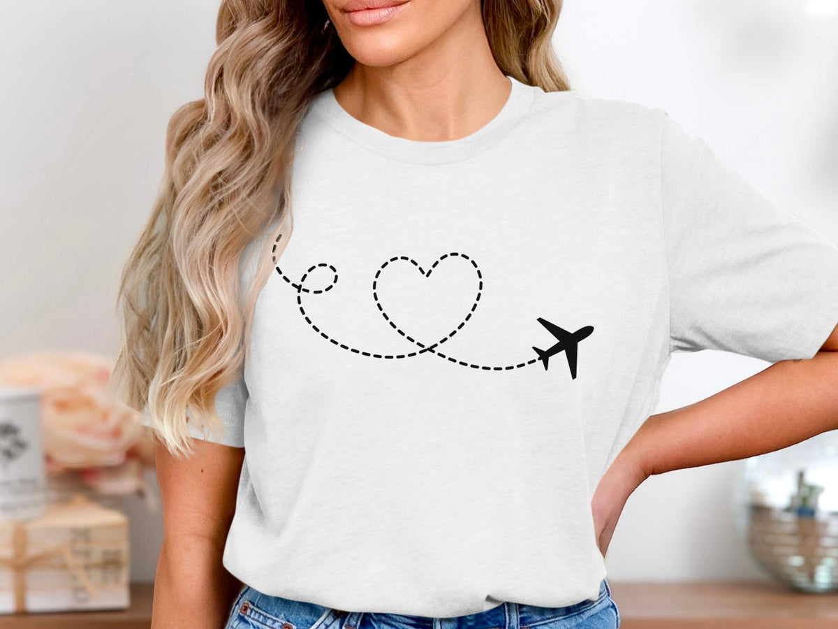 White t-shirt with a black airplane tracing a dotted heart.