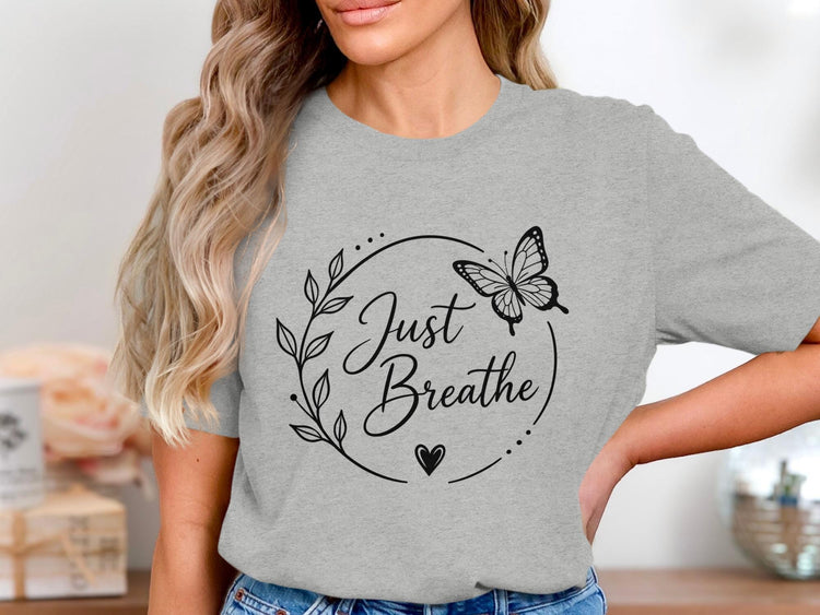 Grey t-shirt with "Just Breathe" text, a butterfly, and floral design.