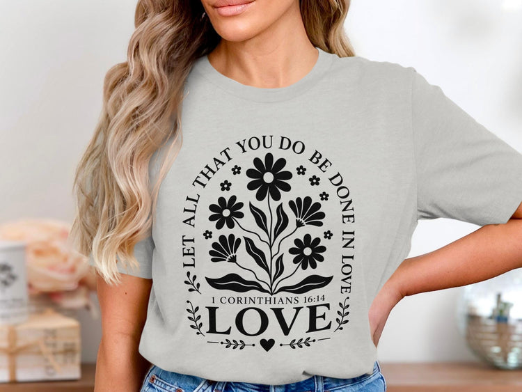 Light gray t-shirt with black floral design and text "LOVE" and Bible verse.