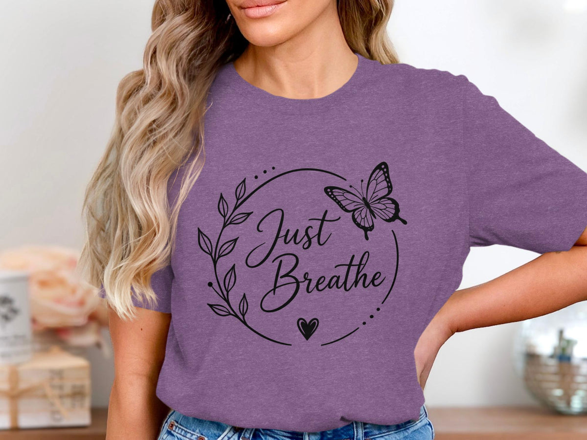 Purple t-shirt with "Just Breathe" text inside a floral circle with a butterfly.