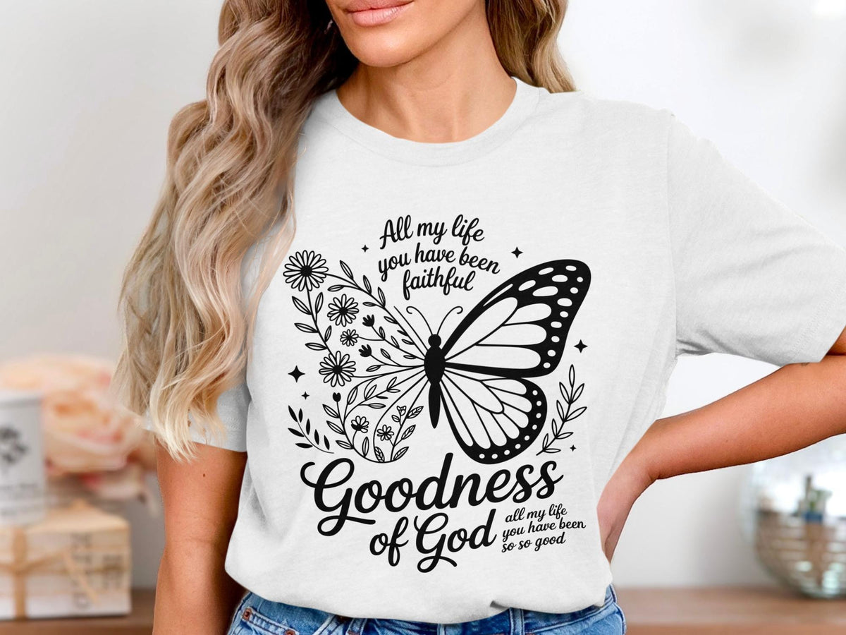White t-shirt with butterfly, flowers, and text "Goodness of God".