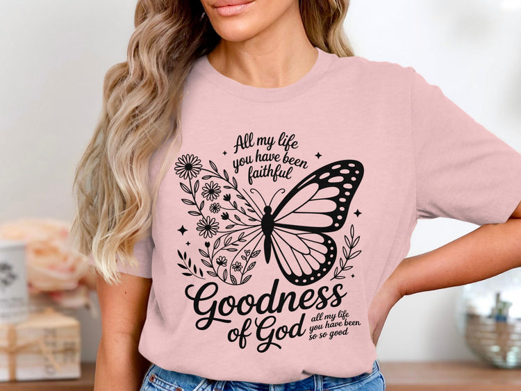 Pink t-shirt with butterfly and floral design, text reads "Goodness of God all my life you have been so so good".
