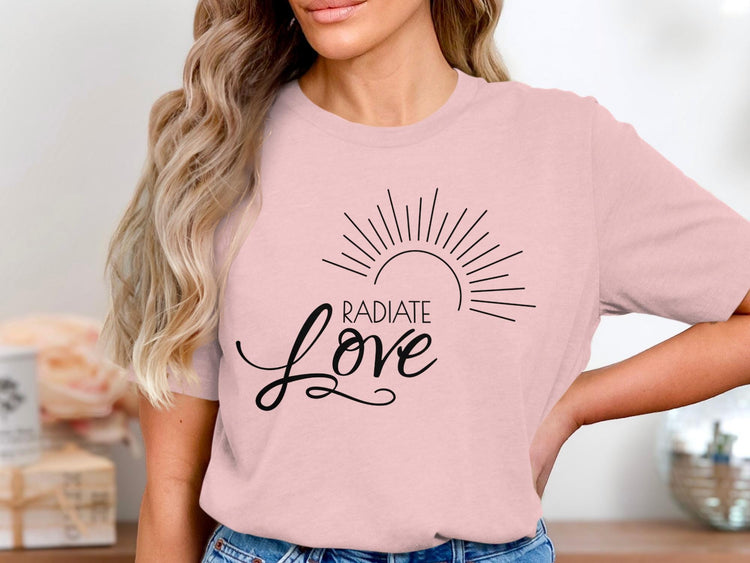 Pink t-shirt with black "Radiate Love" text and a sun graphic.