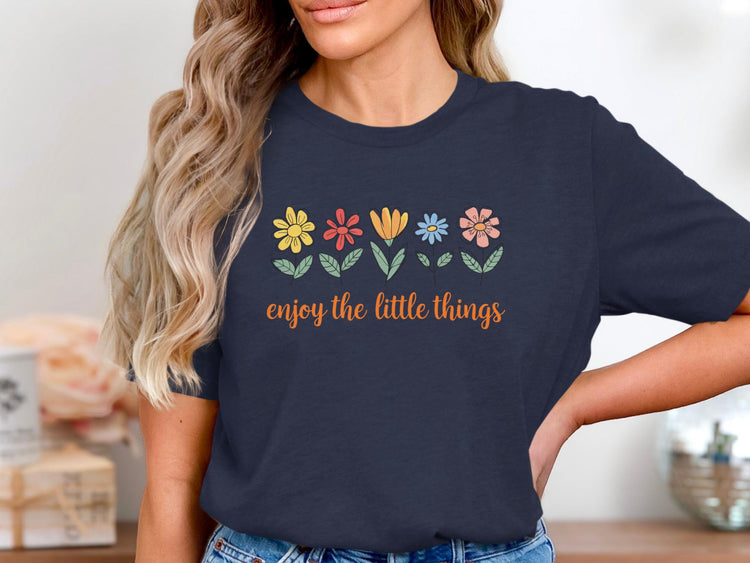 Navy t-shirt with colorful flowers and "enjoy the little things" text.
