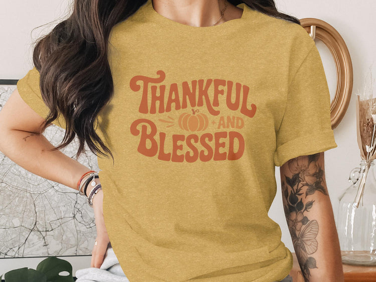 Yellow t-shirt with "Thankful and Blessed" text and a pumpkin graphic.
