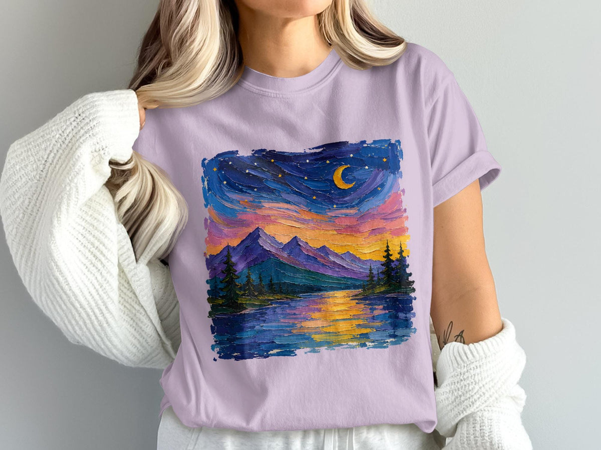 Lavender t-shirt with a textured oil painting of a mountain lake at dusk with crescent moon.