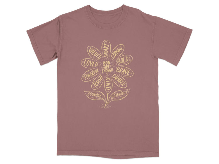 T-shirt with a flower design of positive affirmations like "You are enough."