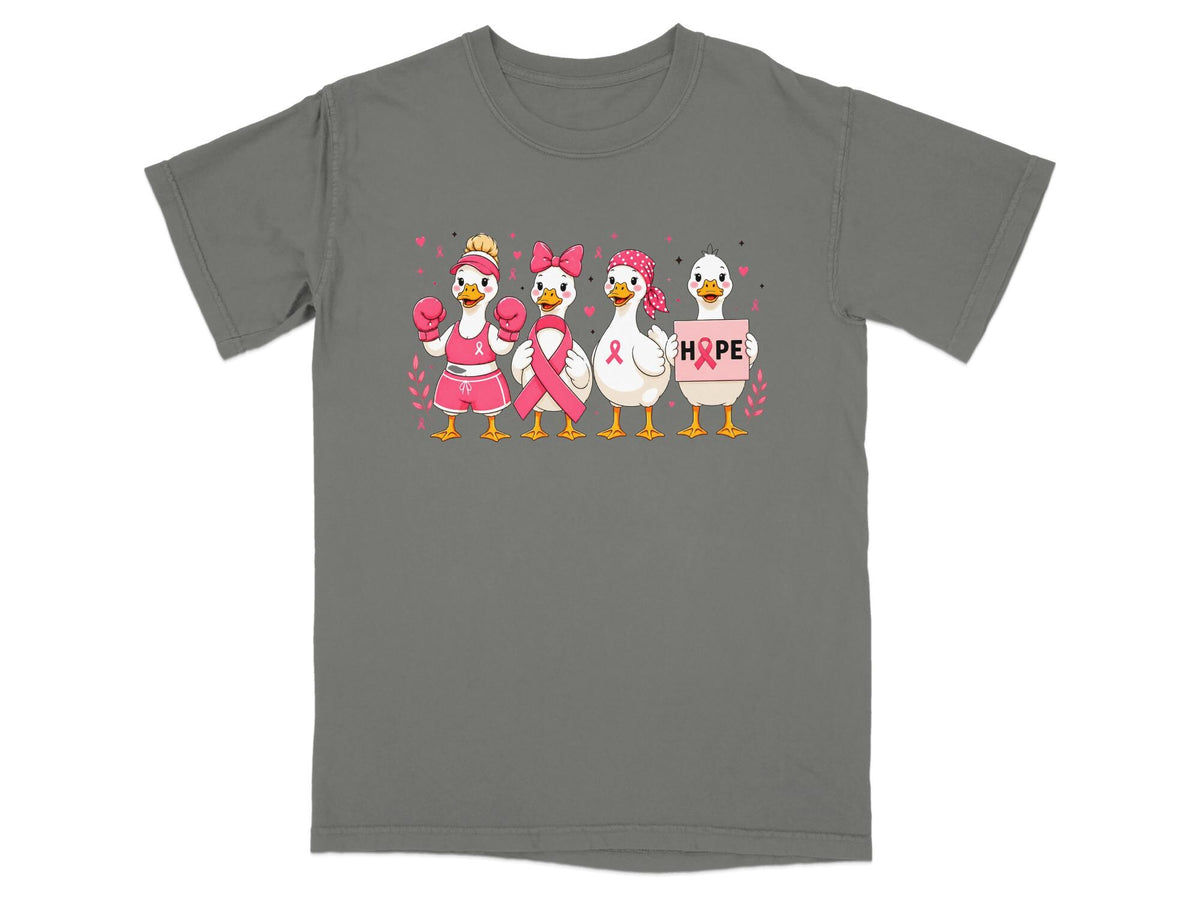 Four ducks wearing pink breast cancer awareness accessories, with one holding a pink "HOPE" sign.