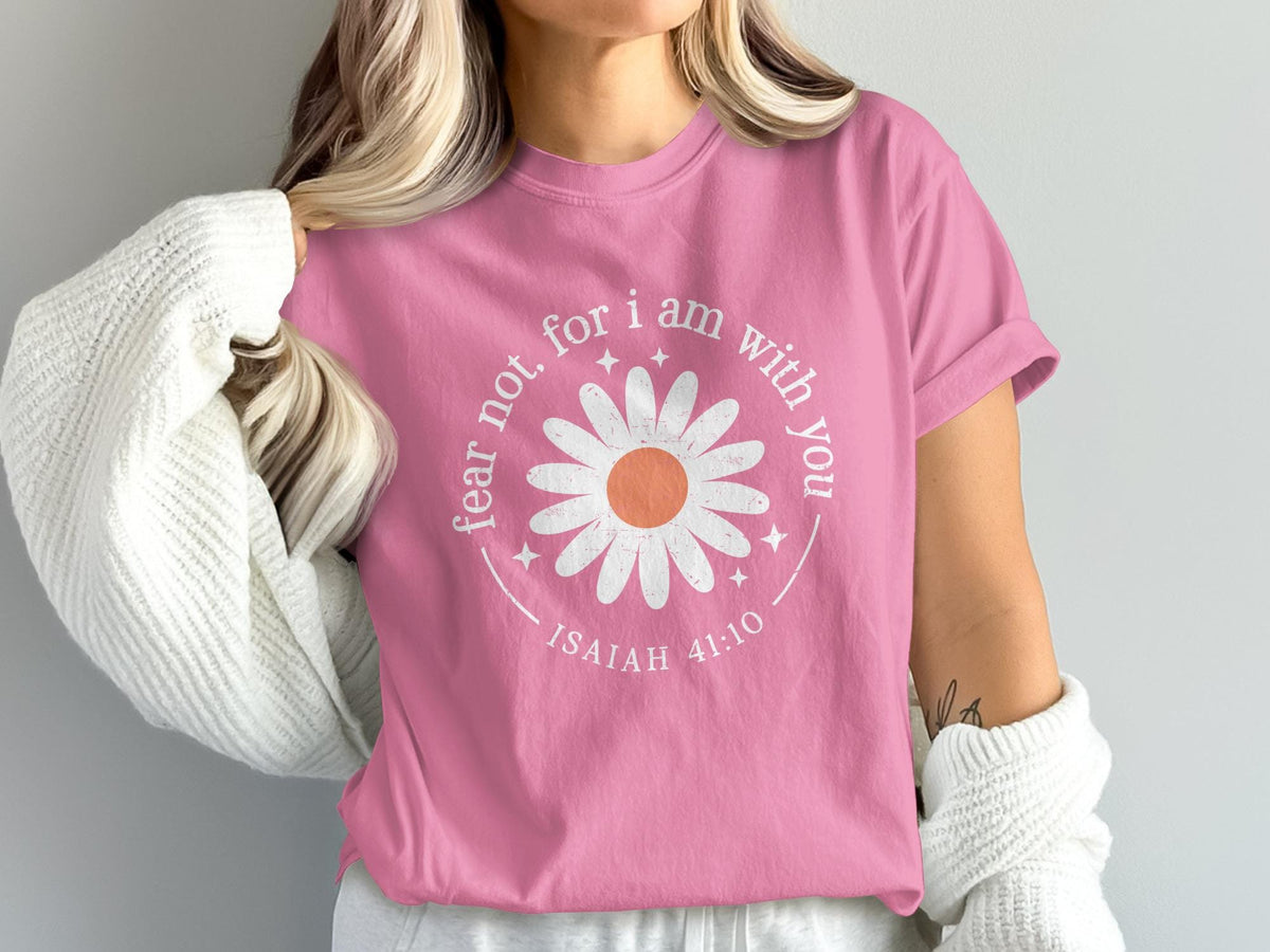Pink t-shirt with a white daisy graphic reading "fear not, for I am with you" and "ISAIAH 41:10".