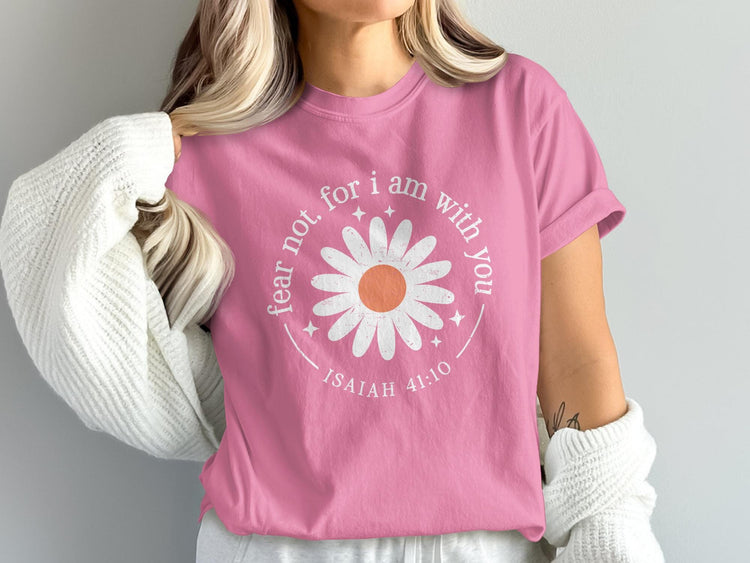 Pink t-shirt with a white daisy graphic reading "fear not, for I am with you" and "ISAIAH 41:10".