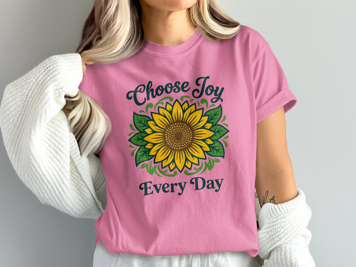 Pink t-shirt with sunflower graphic and text "Choose Joy Every Day".