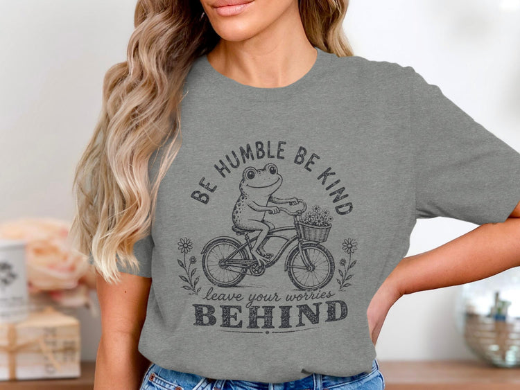 Gray t-shirt with a frog on a bicycle and text "Be Humble Be Kind Leave Your Worries Behind".