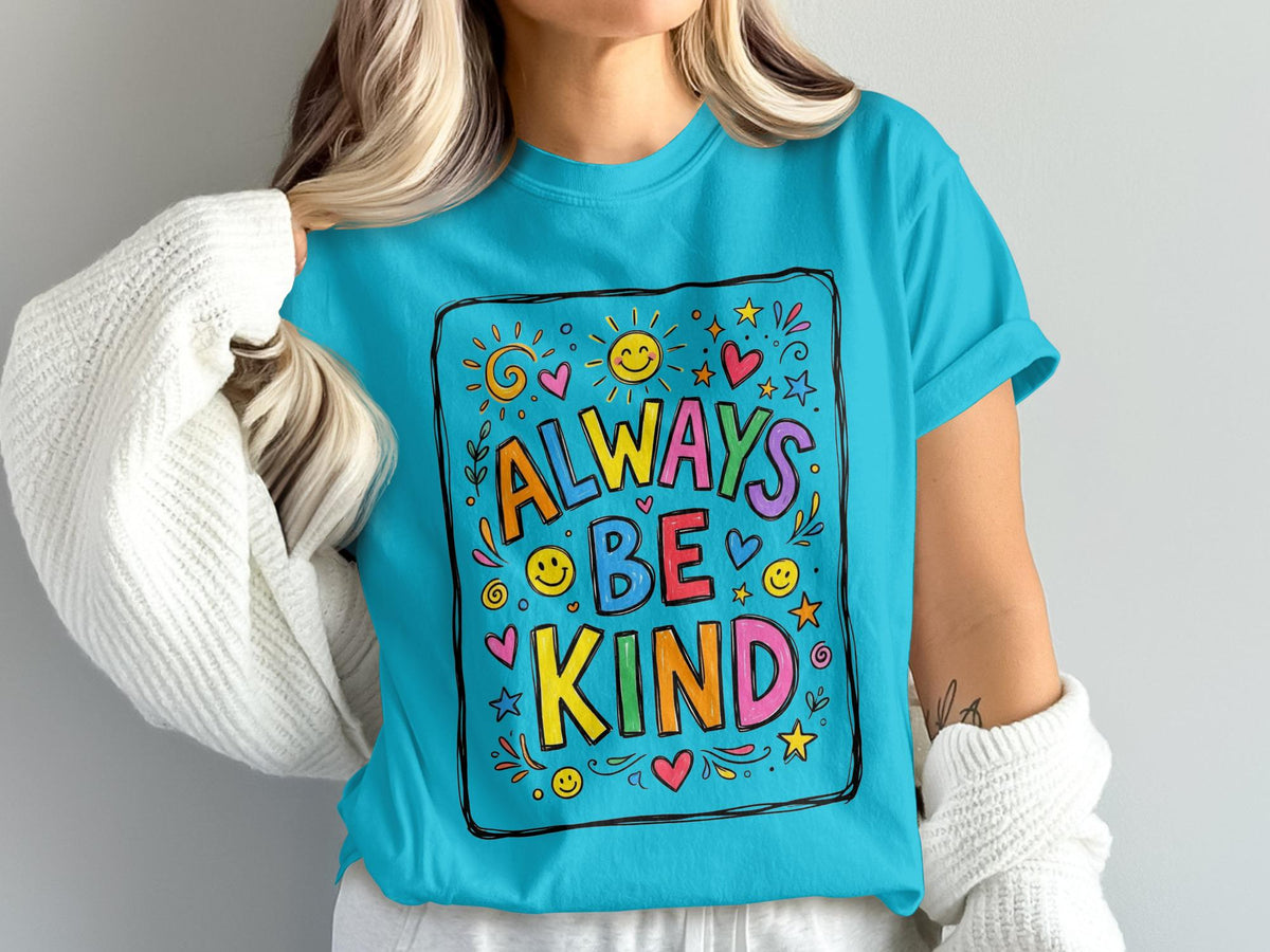 Turquoise t-shirt with "ALWAYS BE KIND" text surrounded by colorful hearts, stars, and suns.