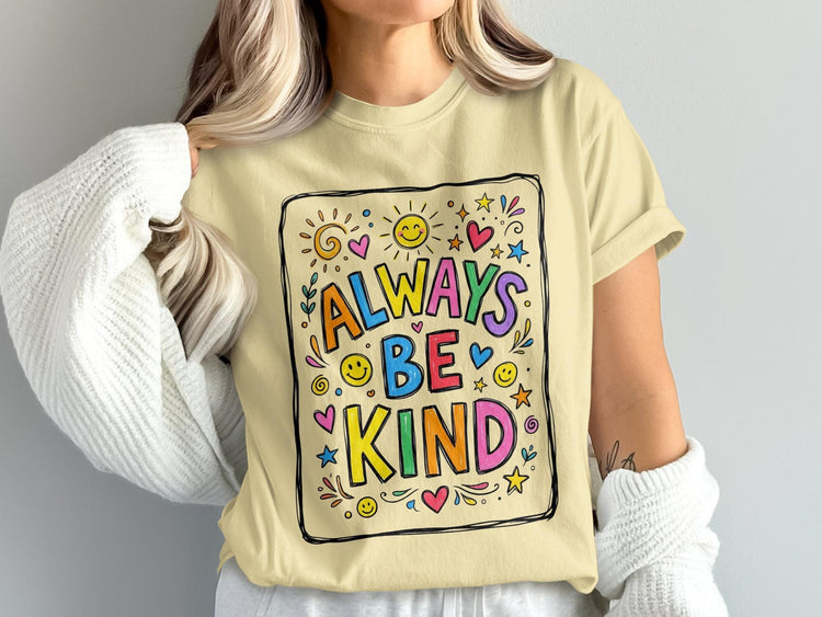 Light yellow t-shirt with colorful "Always Be Kind" graphic featuring smiles and hearts.