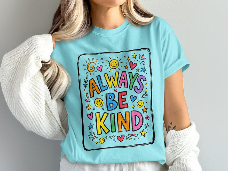 Light blue t-shirt with "ALWAYS BE KIND" in colorful, bold letters surrounded by cheerful graphics.