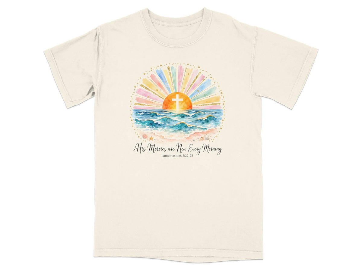 T-shirt with sunrise, ocean, cross, and text "His Mercies are New Every Morning".