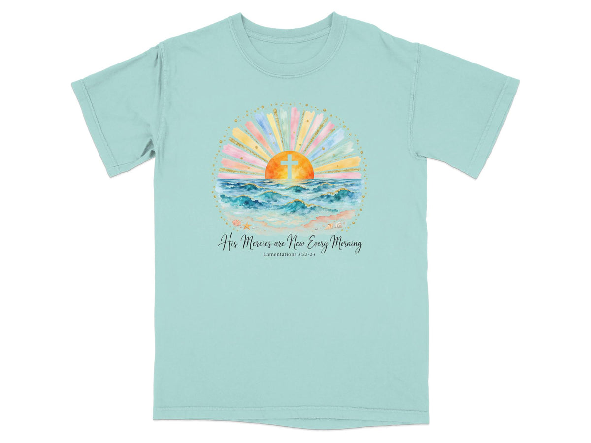 Light blue t-shirt with sunset, cross, ocean, and text "His Mercies are New Every Morning".