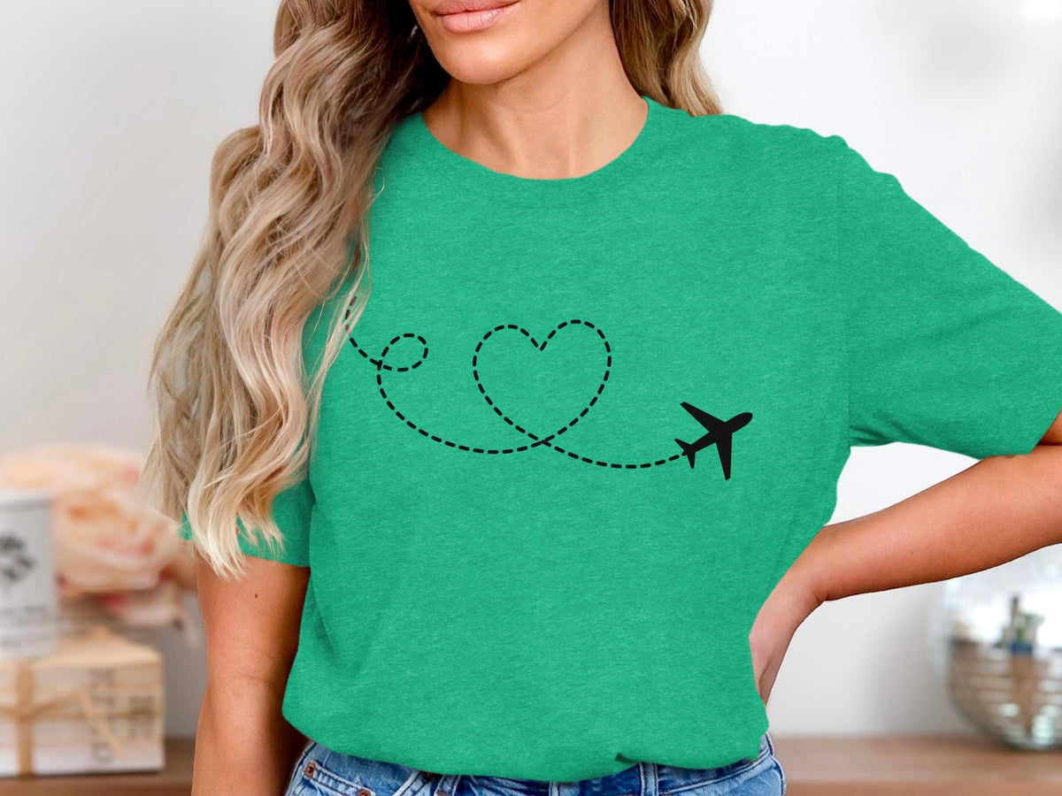 Green t-shirt with black airplane and dashed heart-shaped flight path.
