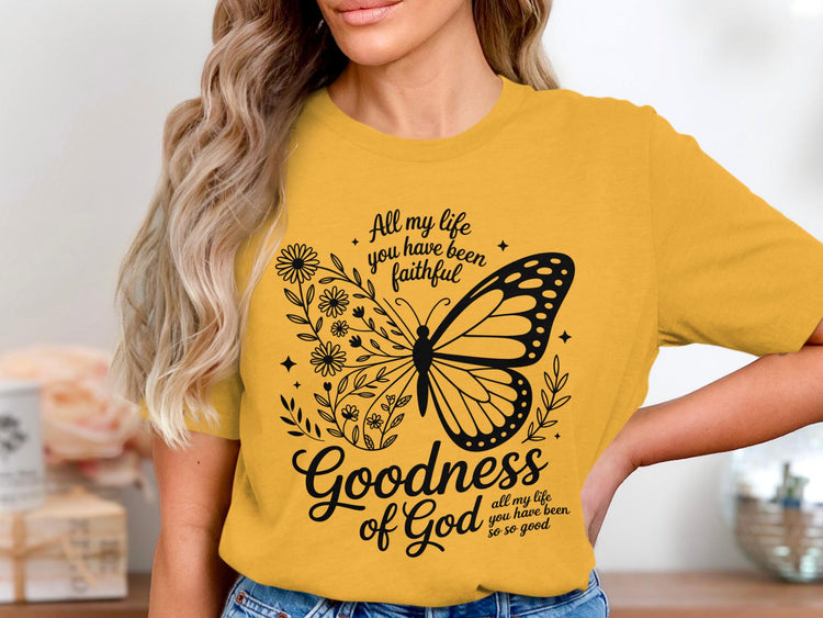Yellow t-shirt with butterfly and floral graphic saying "Goodness of God".
