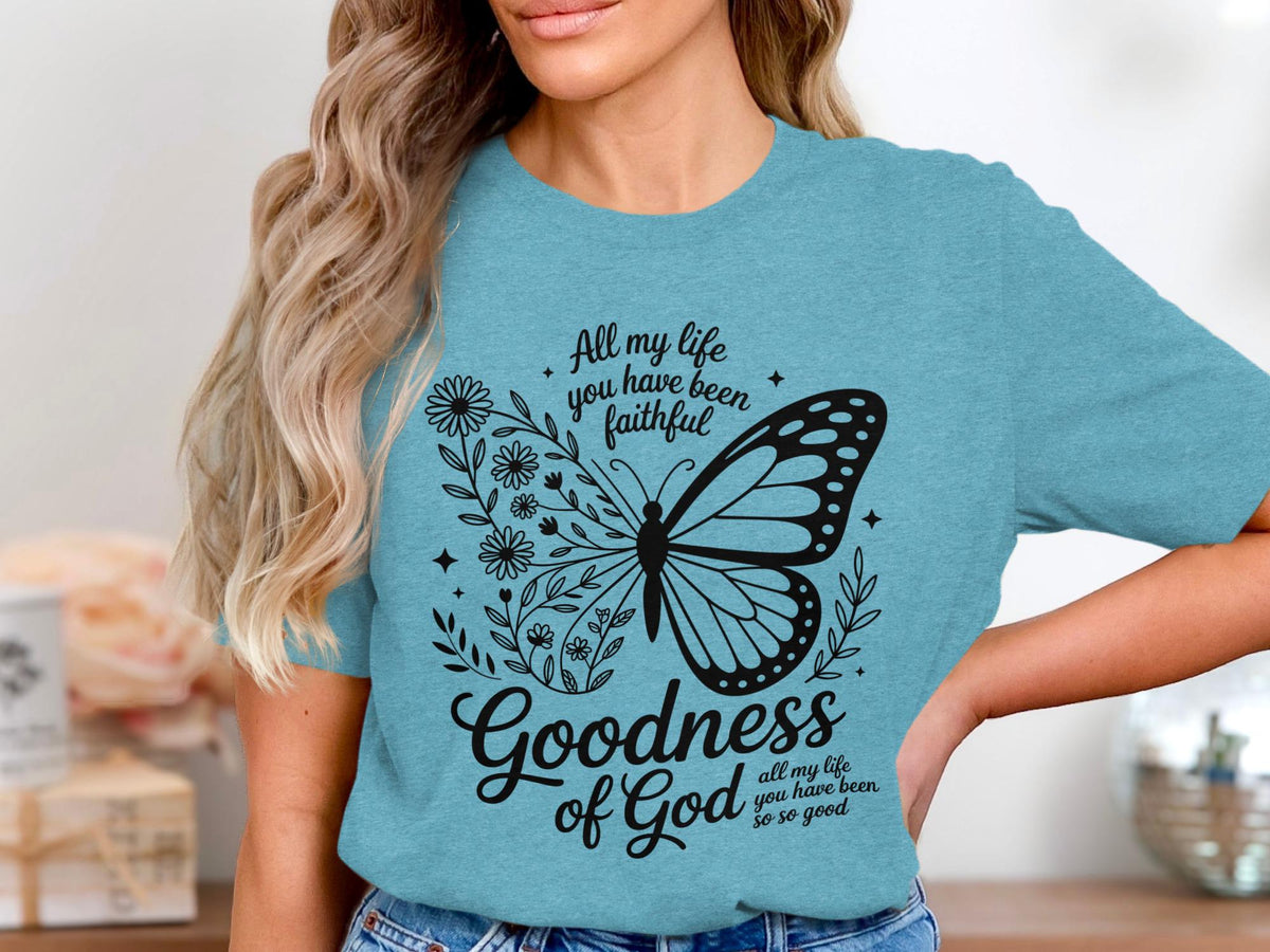 Blue t-shirt with butterfly and floral graphic with text "Goodness of God."