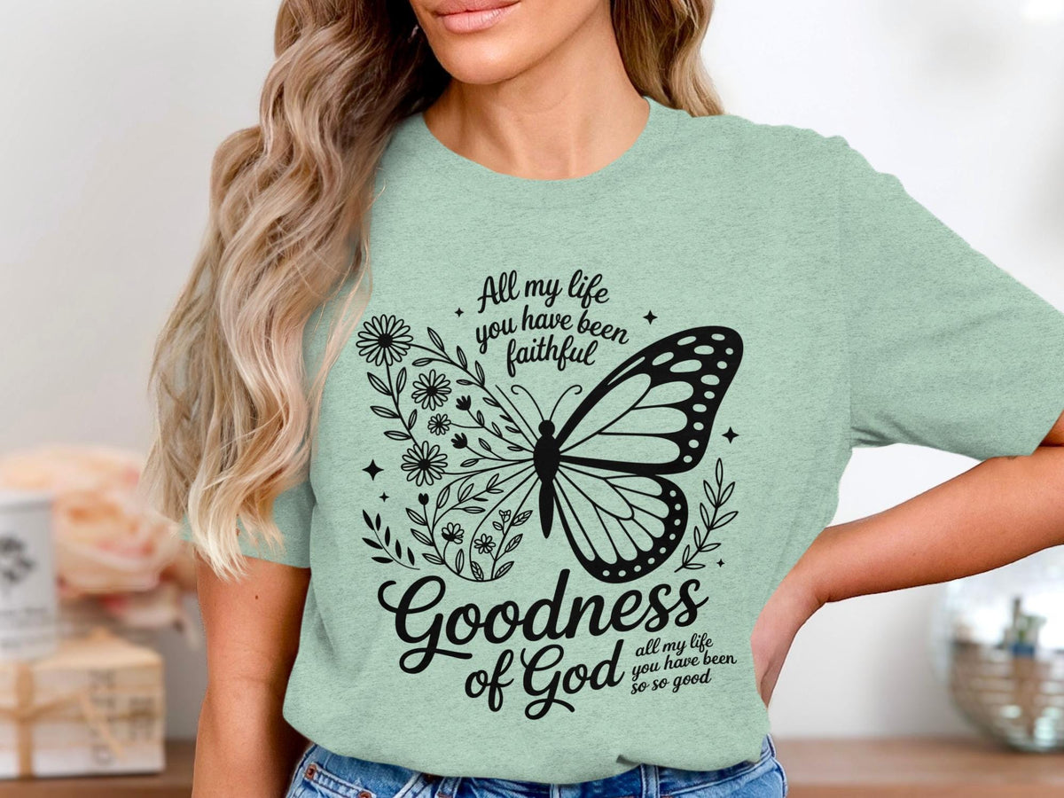 Light green t-shirt with butterfly, flowers, and the text "Goodness of God".