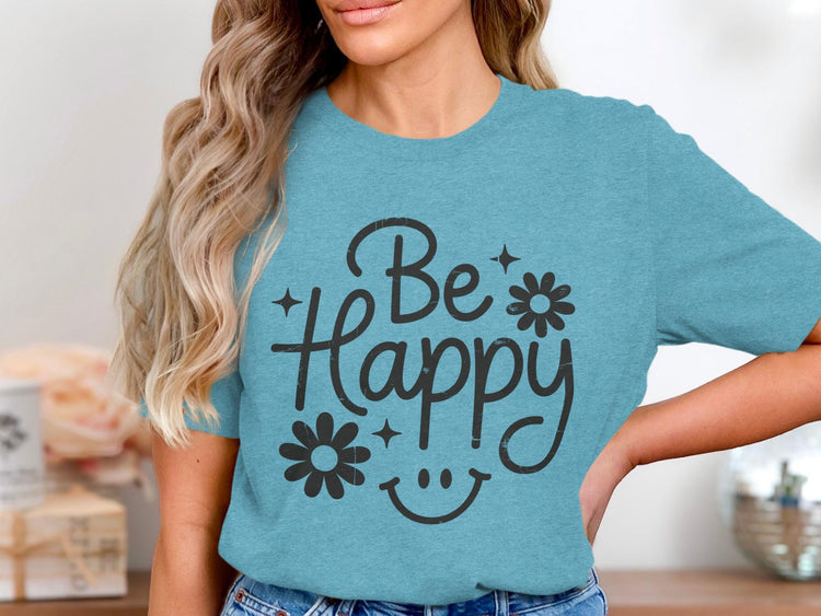 Teal t-shirt with black text and graphics that say "Be Happy"