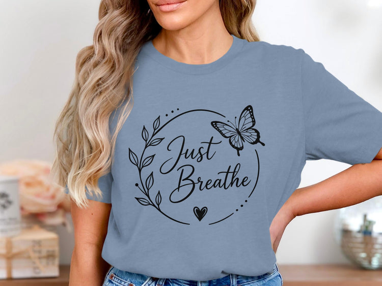 Blue t-shirt with "Just Breathe" text, a butterfly, and floral design.