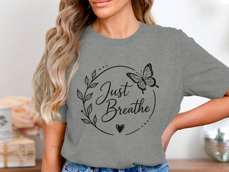 Grey t-shirt with black "Just Breathe" text, butterfly, leaves, and heart design.