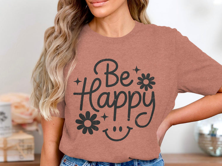 T-shirt with black graphic text "Be Happy" and smiley face.