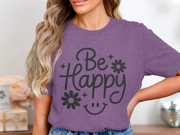 Purple t-shirt with distressed black text "Be Happy" and smiley face graphic.