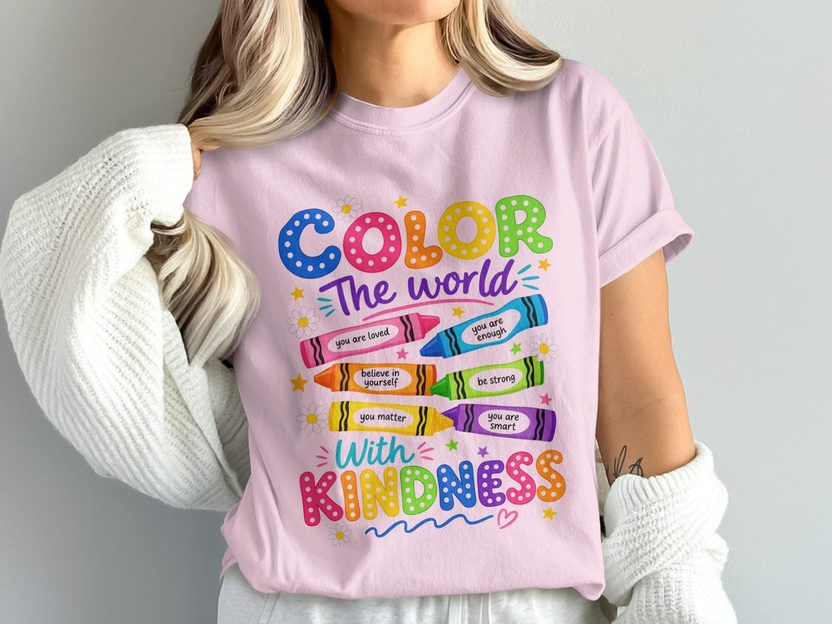 Pink t-shirt with "COLOR The world With KINDNESS" text and crayon graphics.