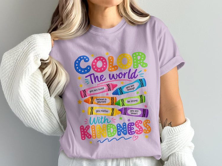 Purple shirt with "COLOR The world With KINDNESS" text and crayon graphics.
