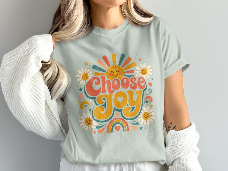 T-shirt with "CHOOSE JOY" text, smiling sun, daisies, rainbow, and stars graphic.