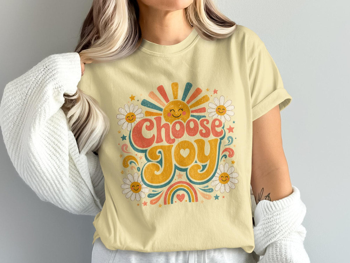 Yellow graphic t-shirt with "Choose Joy" text, sun, daisies, and rainbow.